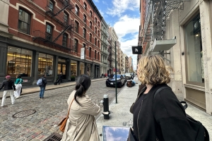 Tour guide pointing out history of SoHo's cast iron district