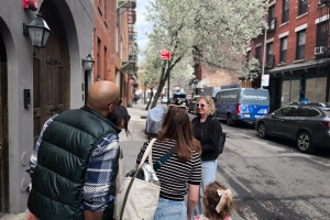 Tour group on a sidewalk in the West Village, NYC